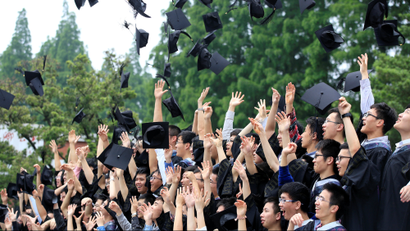 DATE IMPORTED:May 31, 2016Graduates throw their mortar boards as they pose for pictures at Fudan University in Shanghai, China May 31, 2016
