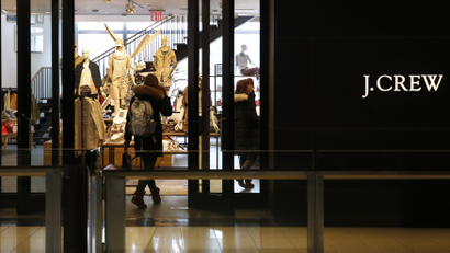 A customer walks into a clothing retailer J.Crew store in Manhattan, New York, March 3, 2014.