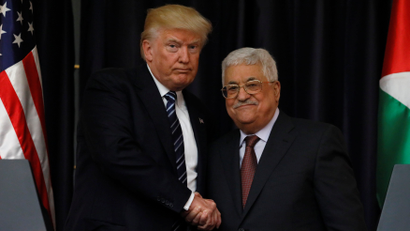 Trump and Abbas shake hands as they conclude their remarks after their meeting at the Presidential Palace in the West Bank city of Bethlehem