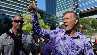 People's Party of Canada leader Maxime Bernier in a purple shirt at a campaign stop.