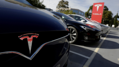 A Tesla Model X is photographed alongside a Model S at a Tesla electric car dealership in Sydney
