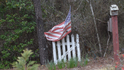 American flag on a fence.