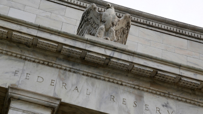 An eagle sculpture tops the U.S. Federal Reserve building's facade in Washington.
