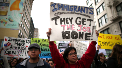 People participate in a protest march calling for human rights and dignity for immigrants, in Los Angeles