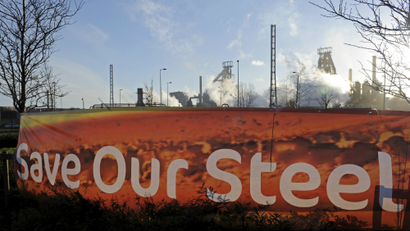 A sign is seen in front of the Tata steelworks in the town of Port Talbot, Wales, Britain March 30, 2016.