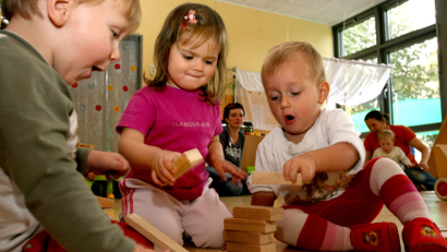 Toddlers playing with blocks