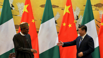 President of the Federal Republic of Nigeria, Muhammadu Buhari and Chinese President, Xi Jinping shake hands during a signing ceremony at the Great Hall of the People in Beijing