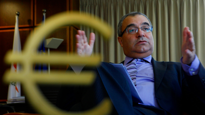 Cyprus’ Central Bank chief Panicos Demetriades gestures during an interview with The Associated Press at his office in central bank of Cyprus in capital Nicosia, Cyprus, Tuesday, Jan. 15, 2013