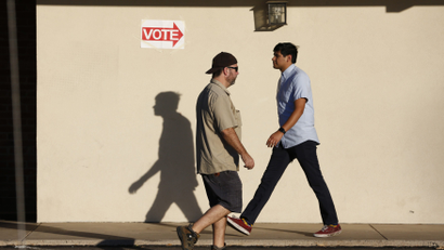 People come and go at a polling site during the U.S. presidential election in Phoenix