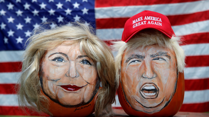 The images of U.S. Democratic presidential candidate Hillary Clinton and Republican Presidential candidate Donald Trump are seen painted on decorative pumpkins created by artist John Kettman in LaSalle