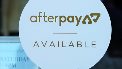A logo for Afterpay in a store window in Sydney