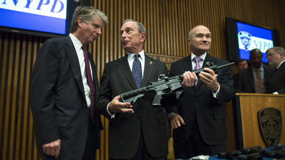 This photo from Friday, Oct. 12, 2012, shows District Attorney Cyrus Vance, left, Mayor Michael Bloomberg, center, NYPD Police Commissioner Ray Kelly, right, with confiscated illegal firearm during a press conference in New York.
