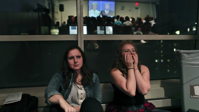 NYU students react while watching the presidential debate between Democratic candidate Hillary Clinton and Republican candidate Donald Trump during a debate watch gathering, Wednesday, Oct. 19, 2016, in New York. (AP Photo/Julie Jacobson