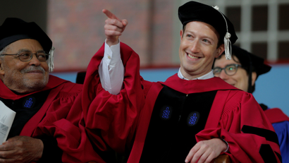 Facebook founder Mark Zuckerberg acknowledges a cheer from the crowd before receiving an honorary Doctor of Laws degree, as fellow honorary degree recipient actor James Earl Jones (L) looks on, during the 366th Commencement Exercises at Harvard University in Cambridge, Massachusetts, U.S., May 25, 2017. REUTERS/Brian Snyder