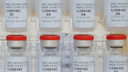 Vials of the Johnson&Johnson Covid-19 vaccine stacked on top of each other.=