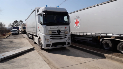 International Committee of the Red Cross (ICRC) trucks wait in line at the Siret border crossing in Siret, Romania March 14, 2022 on their way to deliver aid to Ukraine amid the ongoing Russia's invasion.