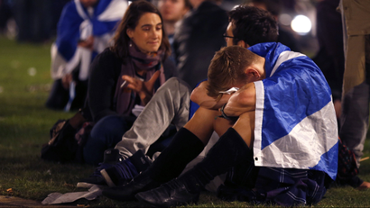 Supporters from the "Yes" Campaign react as they sit in George Square in Glasgow, Scotland September 19, 2014.