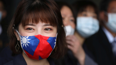 A factory employee wears a face mask with a Taiwanese flag design, as protection due to the coronavirus disease (COVID-19) outbreak, at a factory for non woven filter fabric used to make surgical face masks, in Taoyuan, Taiwan, March 30, 2020.