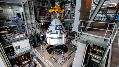 Boeing's Starliner is attached to an Atlas V rocket before a 2019 test flight.
