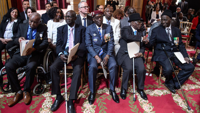 epa05908822 Veterans wait during President Francois Hollande's speech (not pictured) as part of a ceremony to award French citizenship to former Senegalese riflemen veterans at the Elysee Palace in Paris, France, 15 April 2017.