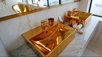 gold bathroom sink in a hotel