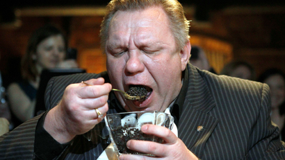 Winner Alexander Valov, 49, eats caviar during a competition which requires contestants to consume 500 grams of caviar in the fastest speed in Moscow April 20, 2012. (RUSSIA - Tags: SOCIETY)