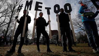 Demonstrators spell out "#METOO" during the local second annual Women's March in Cambridge, Massachusetts, U.S.,