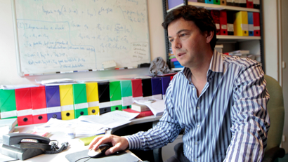 Thomas Piketty, French economist, works in his office in Paris April 11, 2012. At 40, Piketty is one of France's top economists and has won international acclaim for his pioneering work about income inequality worldwide. Picture taken April 11, 2012.