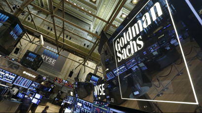 A lighted sign marks the Goldman Sachs trading post on the floor of the New York Stock Exchange, Tuesday, Aug. 5, 2014. The designated market maker operations of Goldman Sachs were sold to Dutch company IMC Financial Markets, which is scheduled to rebrand the post next week. (AP Photo/Richard Drew)