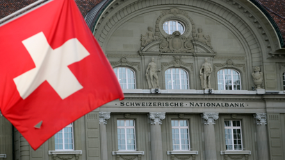 A Swiss flag is pictured in front of the Swiss National Bank (SNB) in Bern