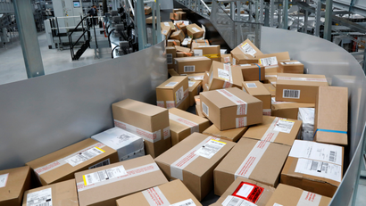 A conveyor belt full of packages at a UPS hub