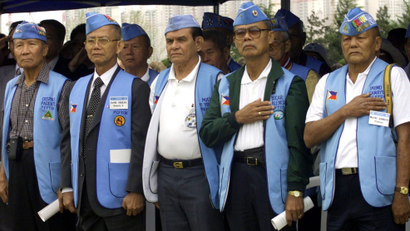 Philippine veterans of Korean War stand at attention during a ceremony to commemorate the 50th anniversary of their participation in the Korean War at the United Nations Memorial Cemetery in southern port city of Pusan, South Korea April 20, 2001. North and South Korea are technically at war after their 1950-53 ended in a truce and not in a peace agreement.