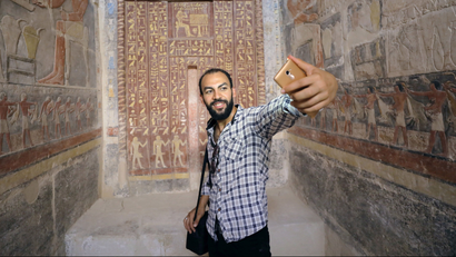 A man takes a selfie in a chamber of the tomb of Mehu, after it was opened for the public at Saqqara area near Egypt's Saqqara necropolis, in Giza