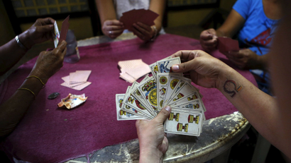 Locals play a Spanish card game known as "sakla" in an underground casino in Manila.
