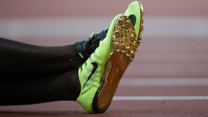 The shoes of Canada's Justyn Warner are seen during the men's 100m semi-final during the London 2012 Olympic Games at the Olympic Stadium August 5, 2012. REUTERS/Lucy Nicholson (BRITAIN - Tags: SPORT ATHLETICS OLYMPICS)