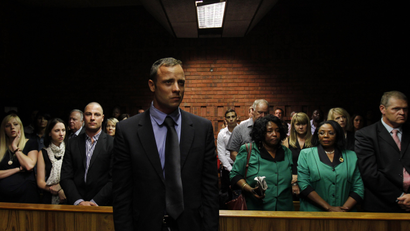 Oscar Pistorius awaits the start of court proceedings in the Pretoria Magistrates court.