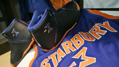A pair of Starbury One high performance sneakers and a Starbury jersey are on display during a news conference Friday, Dec. 8, 2006 in New York.
