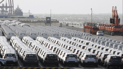 In this photo taken Monday, Oct. 25, 2010, South Korea's automobiles and heavy equipments wait to be shipped to foreign countries at a port in Gunsan, South Korea. South Korea's economic growth slowed sharply in the third quarter on weaker exports and manufacturing as prospects for the global recovery turn cloudy.(AP Photo/Ahn Young-joon