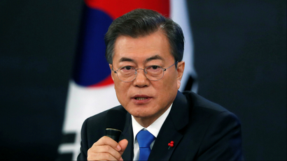 South Korean President Moon Jae-in answers reporters' question during his New Year news conference at the Presidential Blue House in Seoul, South Korea
