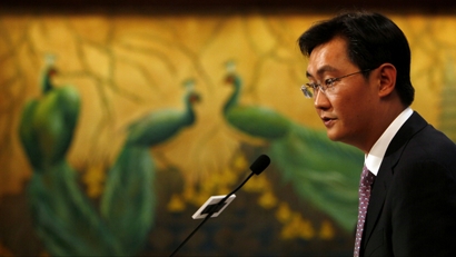 Pony Ma, chairman and CEO of Tencent Holdings Ltd., speaks during the news conference for the 2009 fourth quarter and annual company result announcement in Hong Kong Wednesday, March 17, 2010. Tencent, a leading provider of Internet and mobile and telecommunications services in China, announced their profit for the year was RMB5,221.6 million (US$764.7 million), an increase of 85.4% year on year. (AP Photo/Kin Cheung