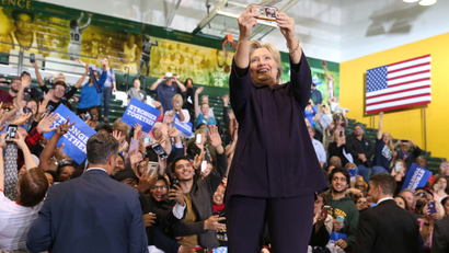 U.S. Democratic presidential nominee Hillary Clinton takes a selfie with the crowd at a voter registration rally at Wayne State University in Detroit