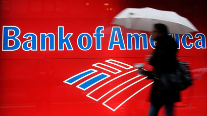 Woman passes Bank of America sign