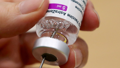 A medical worker prepares a dose of Oxford/AstraZeneca's Covid-19 vaccine