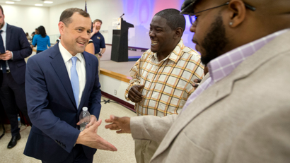 Democratic Gubernatorial candidate former Congressman Tom Perriello, left, greets supporters after a debate at a Union hall in Richmond, Va., Tuesday, May 9, 2017. The two candidates face off in the June 13th primary.