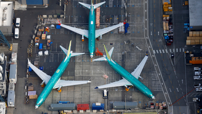 A photo of Boeing 737 MAX airplanes parked on the tarmac at the Boeing Factory in Renton