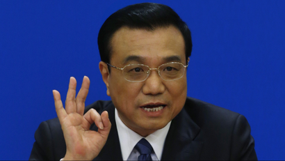 China's Premier Li Keqiang gestures as he speaks during a news conference, after the closing ceremony of the Chinese National People's Congress (NPC) at the Great Hall of the People, in Beijing, March 13, 2014. REUTERS/Barry Huang