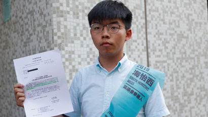 Joshua Wong, secretary-general of Hong Kong's pro-democracy Demosisto party, poses before submitting his application for the race in the 2019 District Council Election, at the Southern District Office in Hong Kong, China, October 4, 2019.