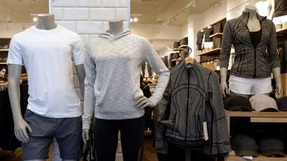 Clothes are displayed in a Lululemon Athletica retail store