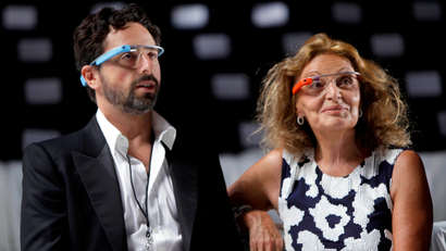 Diane Von Furstenberg watches a practice run of her Spring 2013 show with Google co-founder Sergey Brin during Fashion Week in New York, Sunday, Sept. 9, 2012. Both are wearing Google Glass, headwear that contains electronics such as a computer processor and a camera.