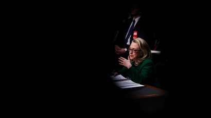 U.S. Secretary of State Hillary Clinton is framed between members of the media as she testifies on the September attacks on U.S. diplomatic sites in Benghazi, Libya, during a Senate Foreign Relations Committee hearing on Capitol Hill in Washington January 23, 2013.